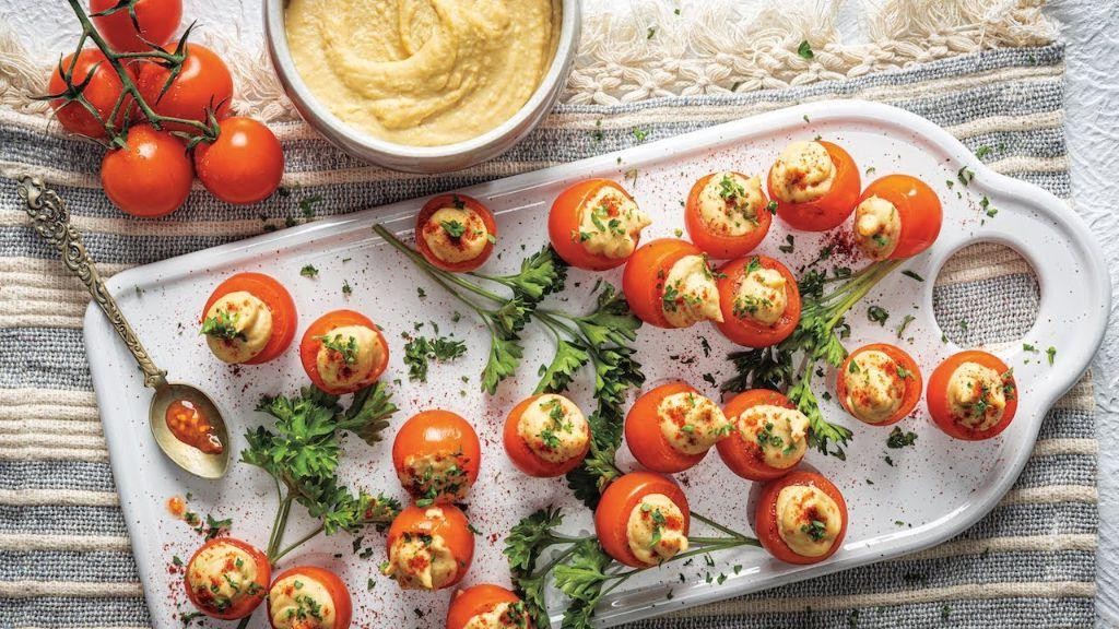 Cucumber and hummus stuffed cherry tomatoes