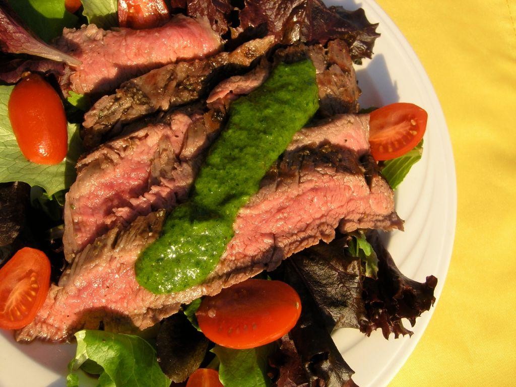 Grilled Steak with Chimichurri Sauce and Steamed Spinach