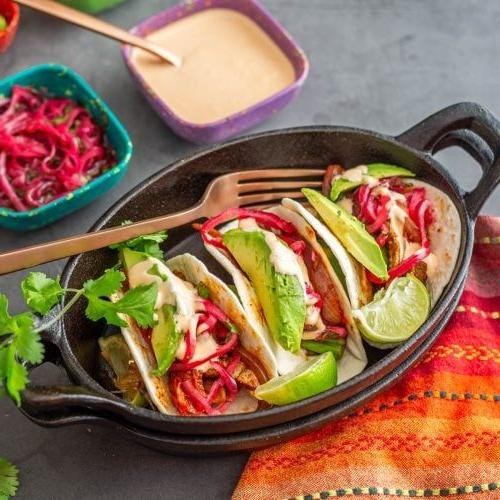 Lomo Saltado Tacos with Fresh Lime Crema