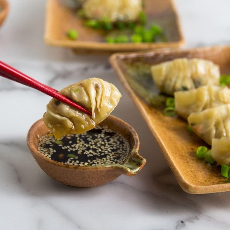 Thai-Inspired Chicken Pot Stickers with Peanut Sauce