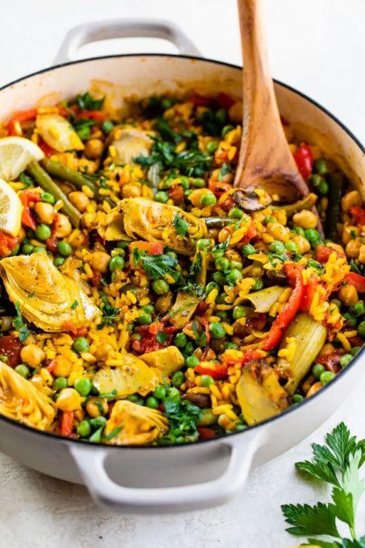 Vegetarian Dutch oven paella with artichokes and peas